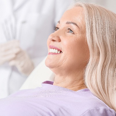 woman smiling while visiting dentist 