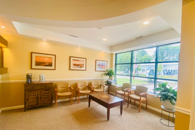 Dental treatment room with window and yellow walls