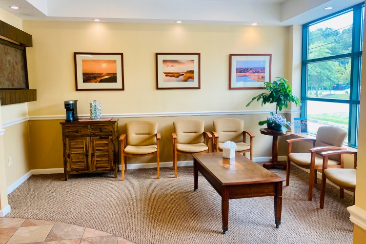 Dental treatment room with window and yellow walls