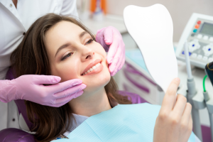 a patient smiling while visiting their cosmetic dentist 